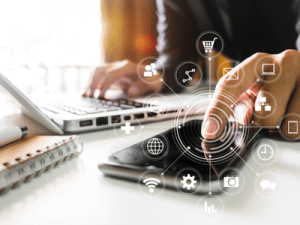 Virtual care: person using phone and laptop for multiple services